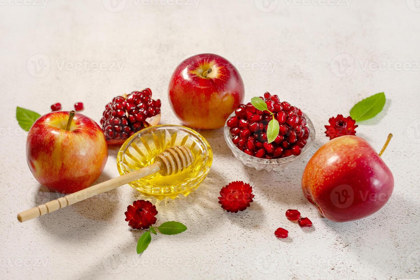 Rosh Hashanah, the Jewish New Year. Traditional symbols are apples, pomegranate and honey on a light background a place to copy. Happy Rosh Hashanah. Shana Tova photo