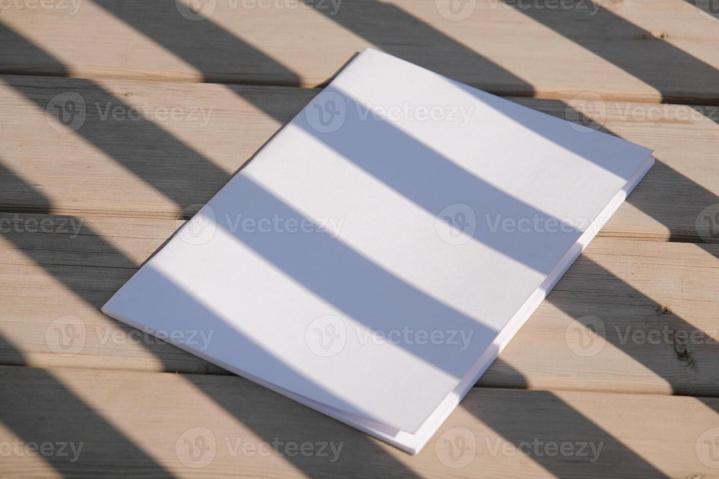 magazine mockup rustic wooden background with shadow stripes photo