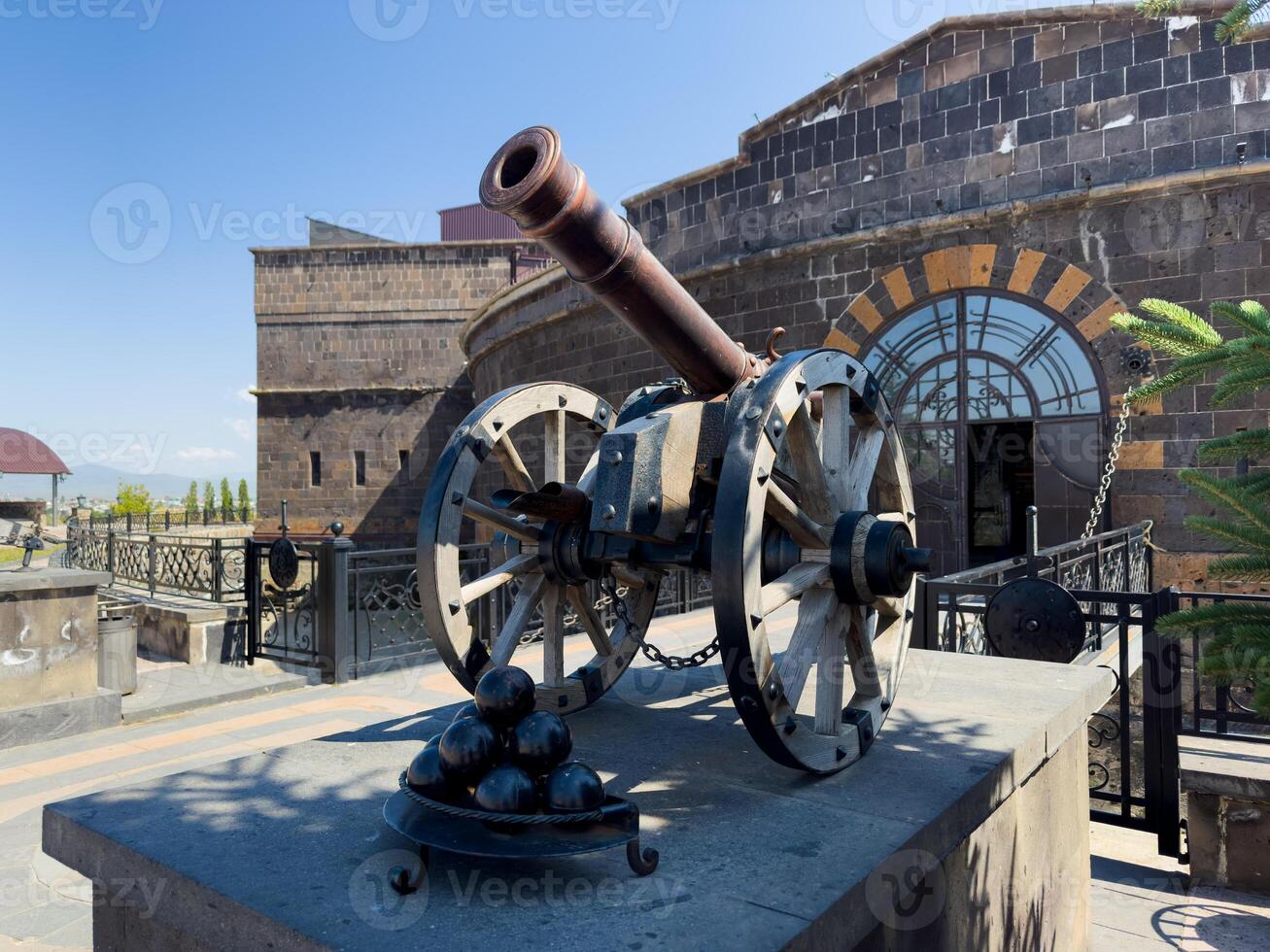 A cannon in front of a building, castle cannon photo