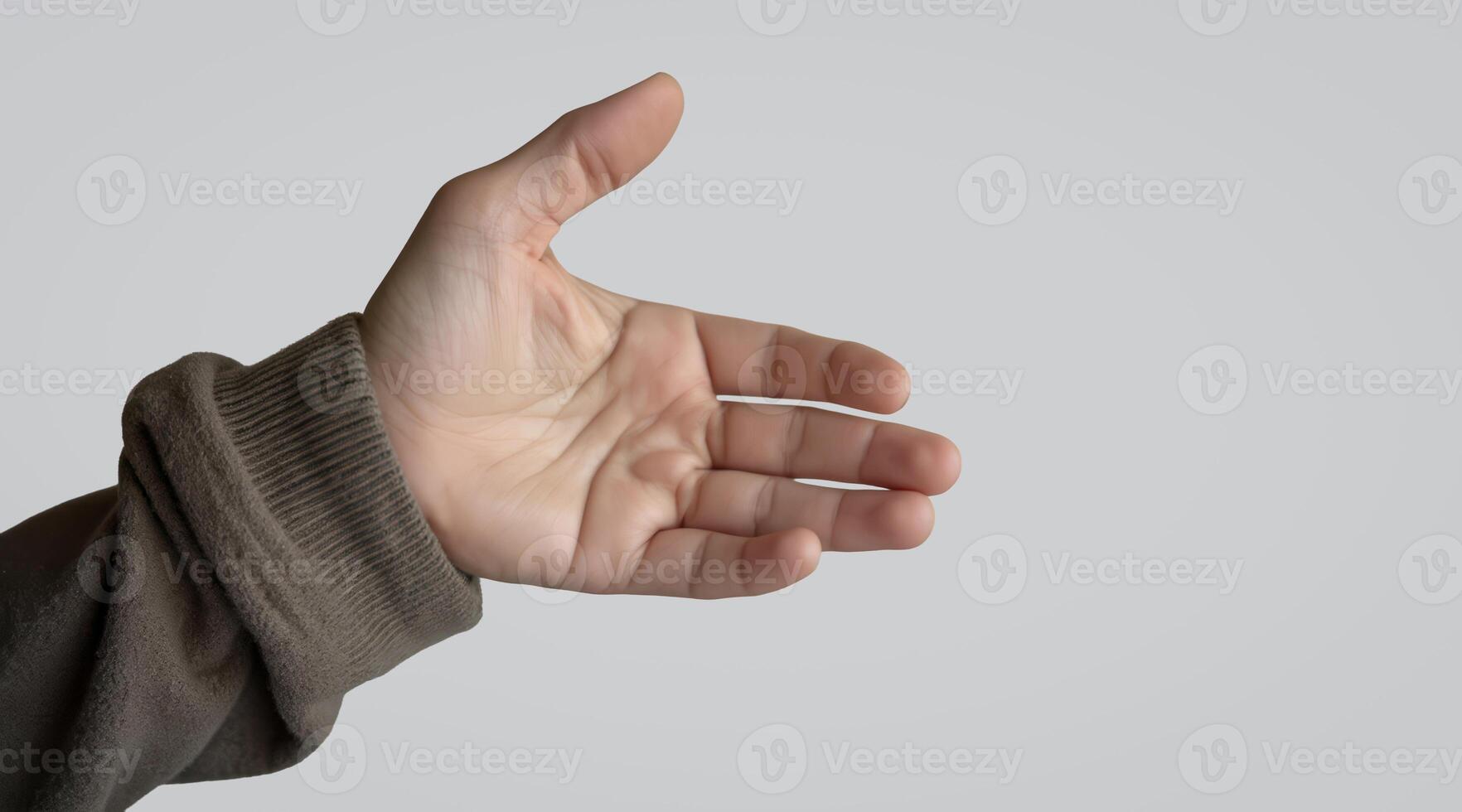 hand extends upwards in a welcoming gesture against a neutral background. photo