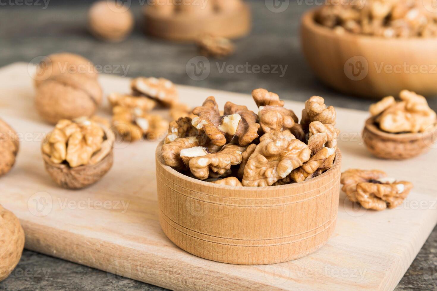 Fresh walnuts in wooden bowls photo