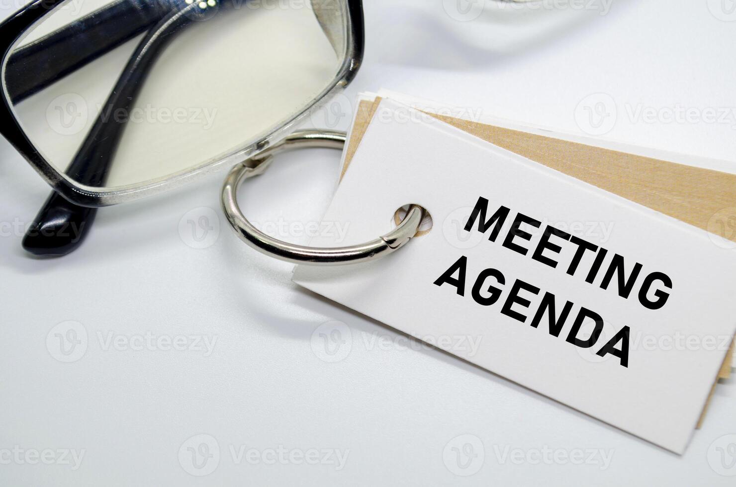 Meeting Agenda with keyring on white notepad photo