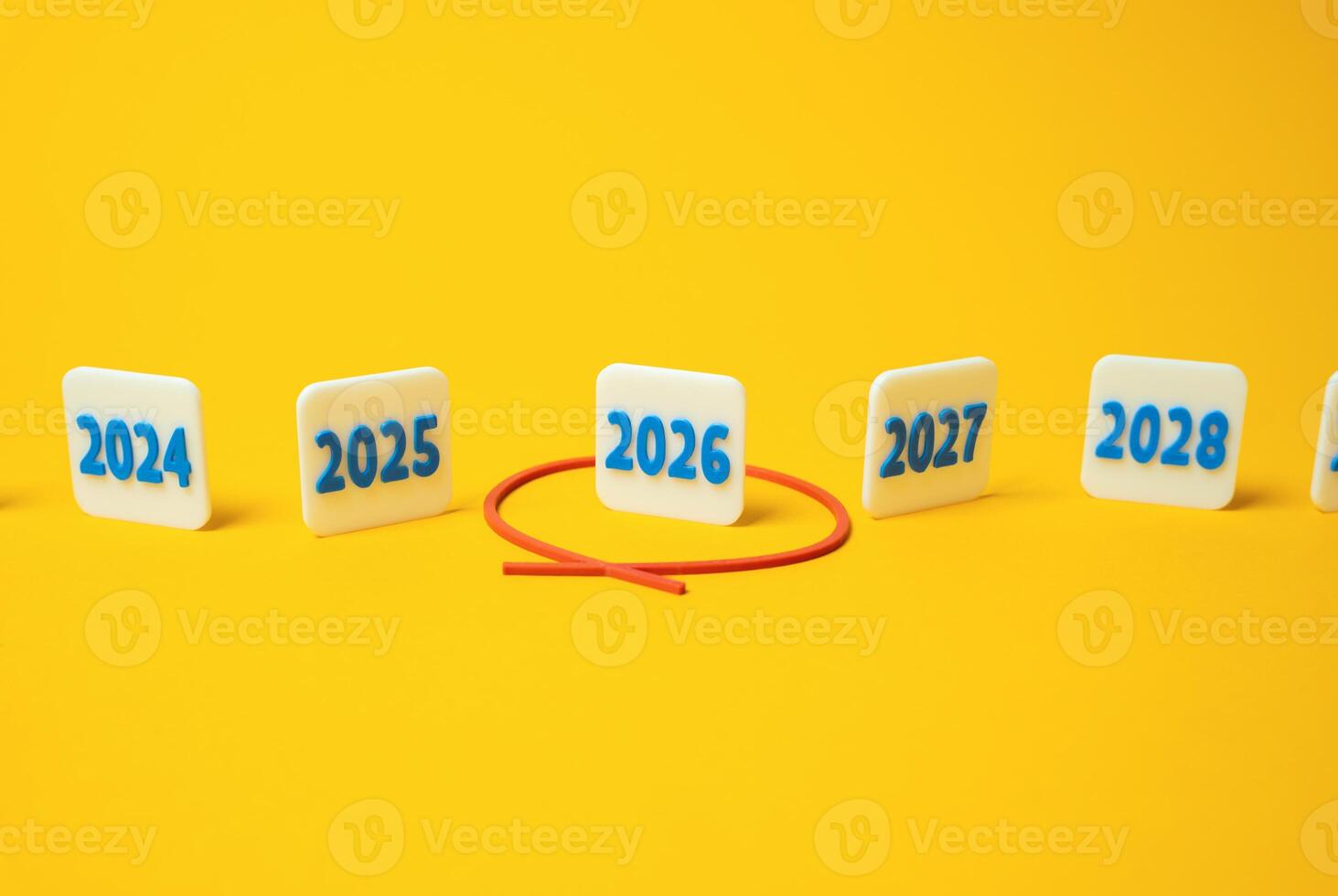 The year 2026 is circled in red in a number of others. Future planning. Financial forecasts, election years, economic cycles, or goal setting. photo