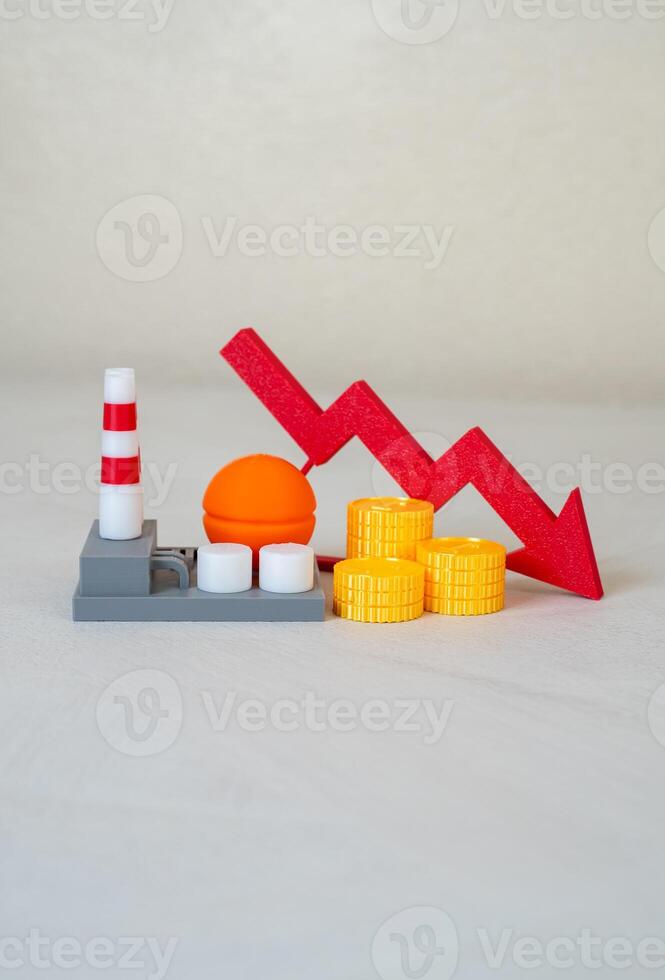 Power company and red arrow pointing down. Worsening of the economic situation of the enterprise. Debt accumulation, inefficiency, or changing energy consumption trends. photo