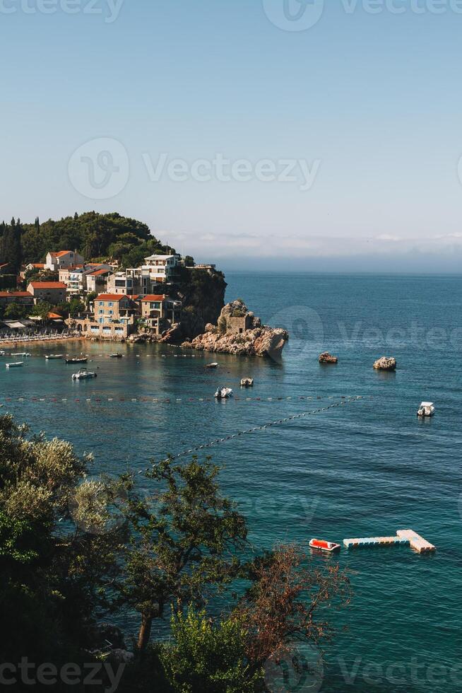 Amazing view of Przno and the Adriatic sea near Budva, Montenegro on a summer day. Travel destination in Montenegro. photo