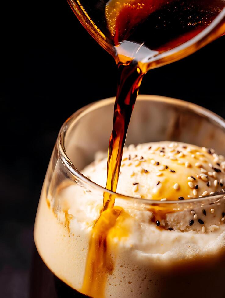 Close up of Coffee Being Poured Over Sesame Ice Cream. photo