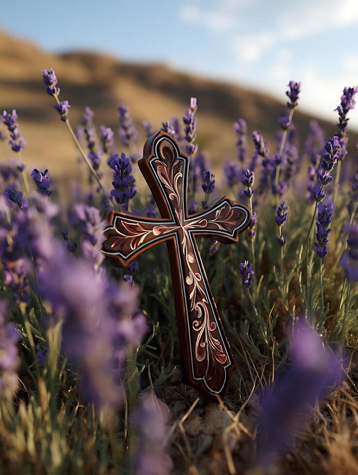 Ornate Wooden Cross in Lavender Field at Sunset. A detailed close up image of a beautifully carved wooden cross resting amongst vibrant purple lavender flowers. photo