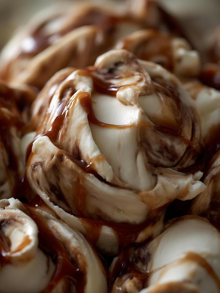 Close Up of Creamy Ice Cream with Caramel Sauce Swirls. photo