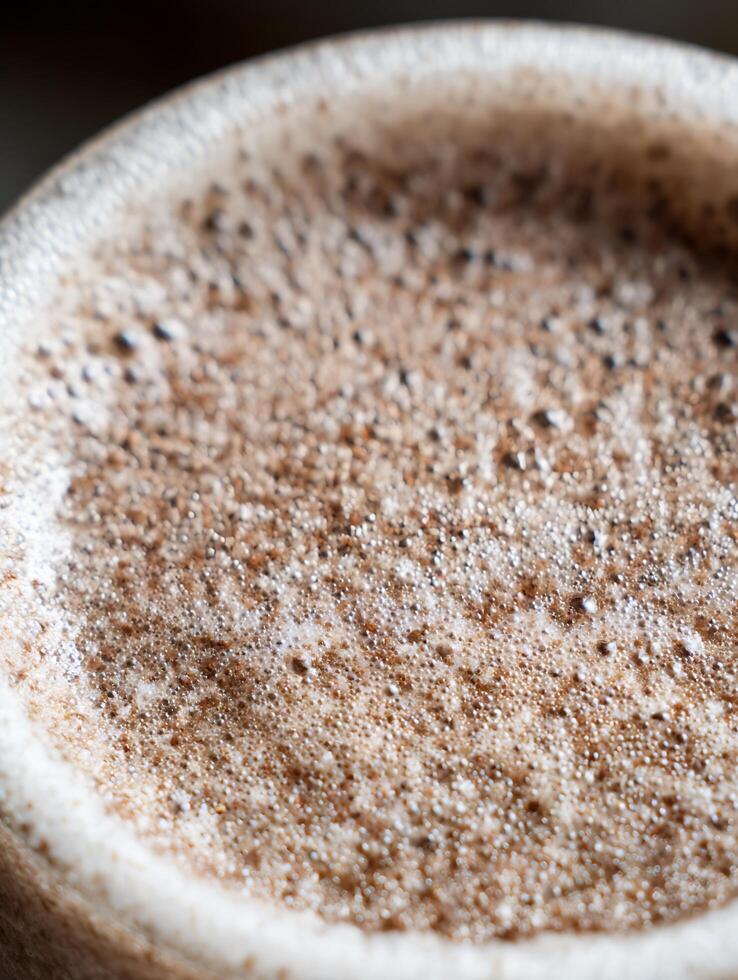 Close Up of Frothy Coffee Crema, Rich Brown Texture. photo