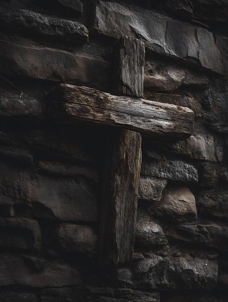 Weathered Wooden Cross on a Dark Stone Wall A Study in Texture and Contrast. photo