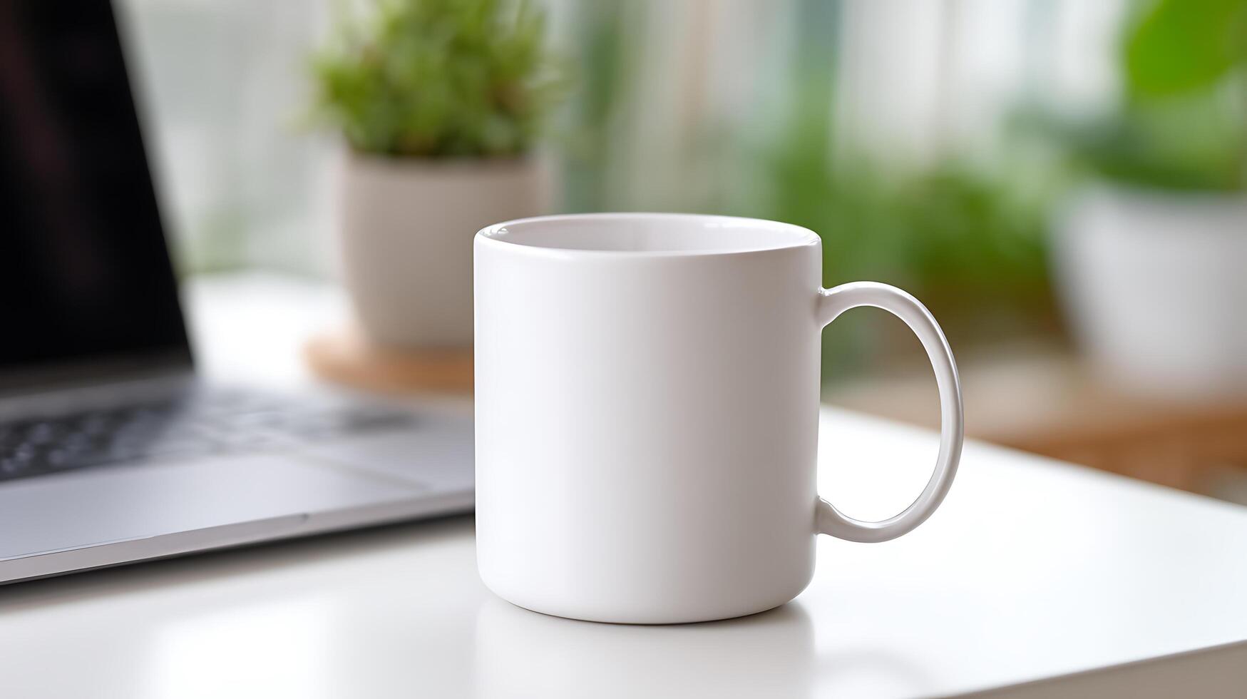 Blank White Mug on a Desk next to a Laptop. A simple, clean image perfect for branding and design projects. photo