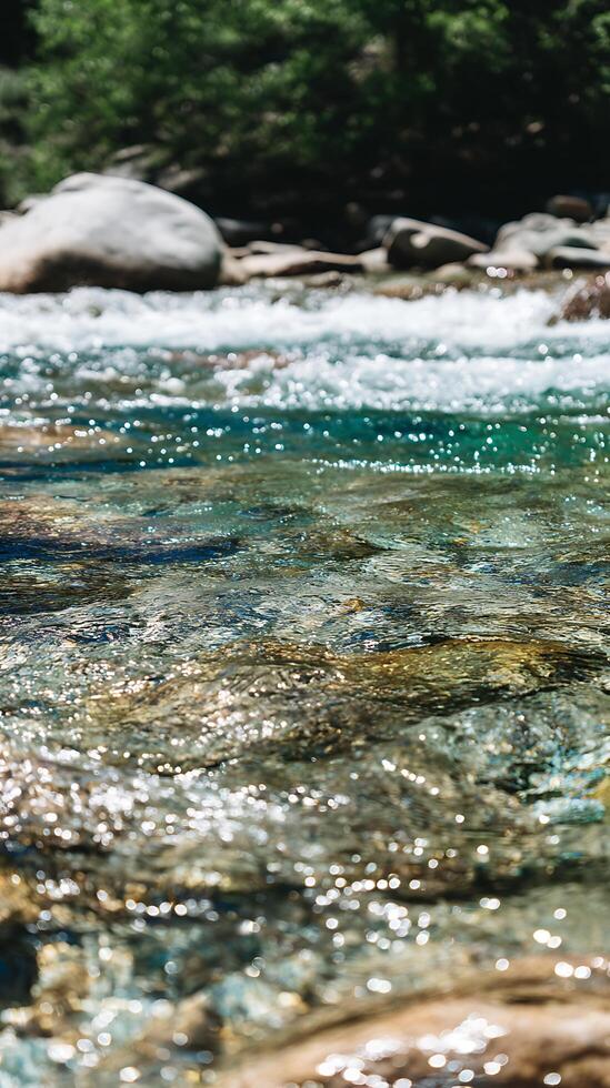Sparkling River Water Close Up Sunlit Stream Flowing Over Smooth Stones. photo