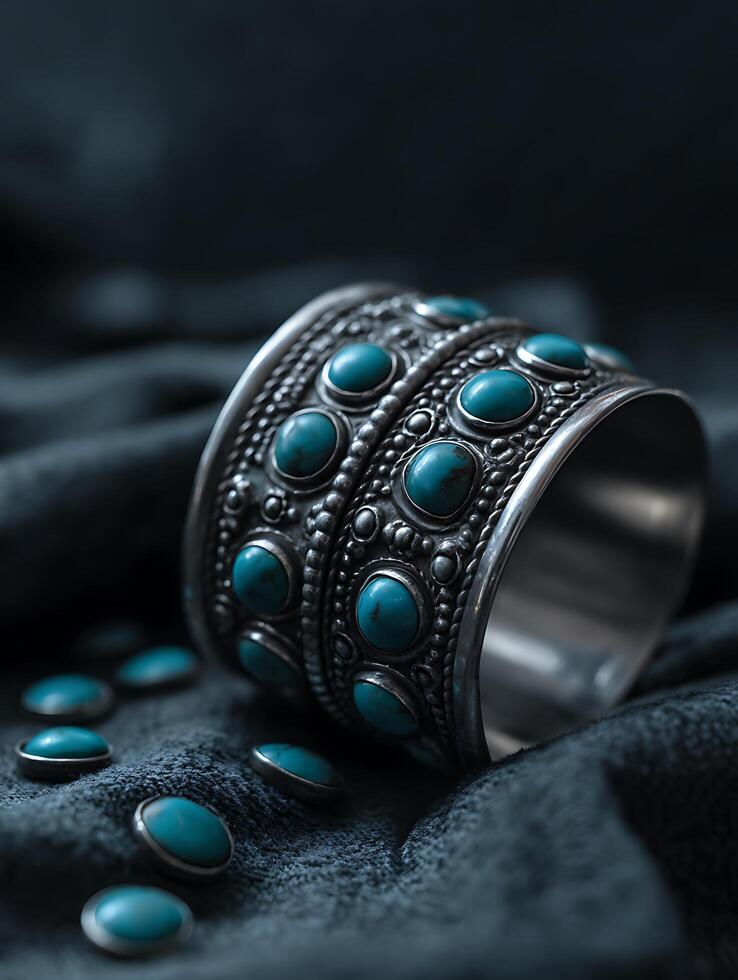 Close up of Elegant Silver Bracelet Adorned with Turquoise Stones. A detailed image showcasing intricate craftsmanship and vibrant gemstone colors. photo