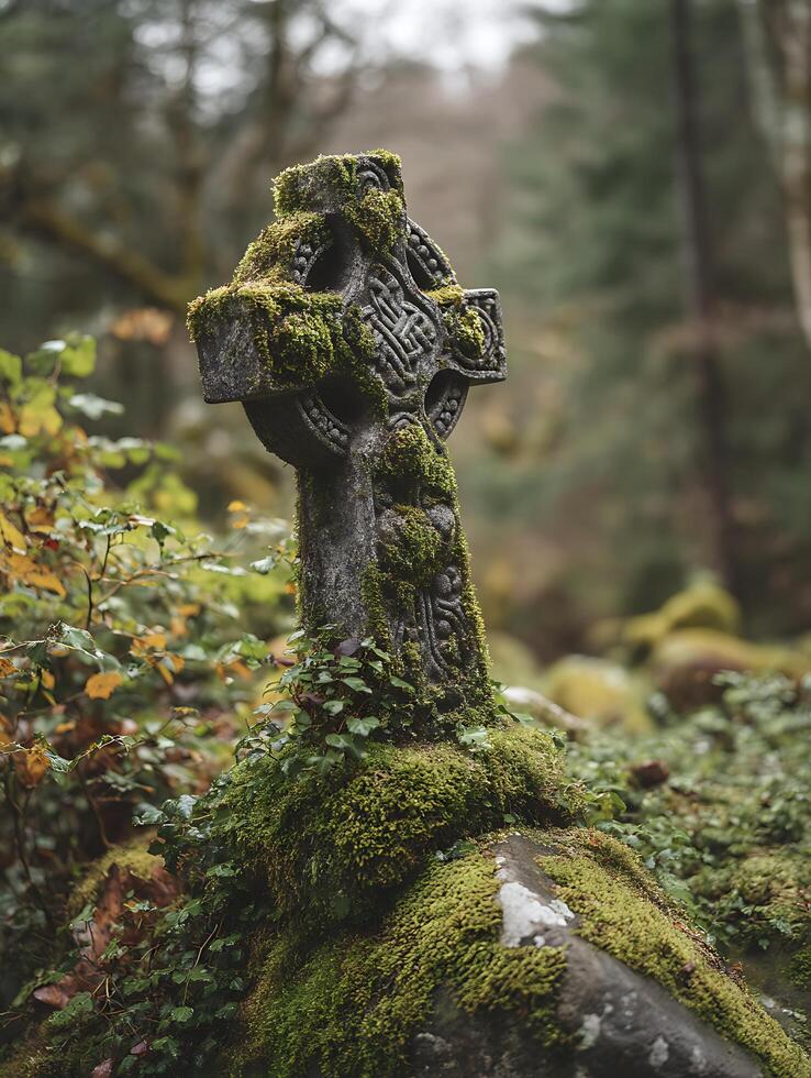 Moss Covered Celtic Cross in a Forest Setting. A close up image of an ancient stone cross. photo