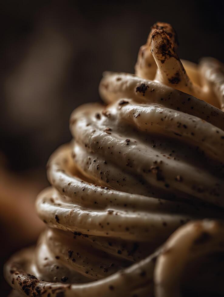 Close Up of Creamy Dessert with Chocolate Sprinkles. A detailed image showcasing the texture and swirls of a delicious-looking confection. photo