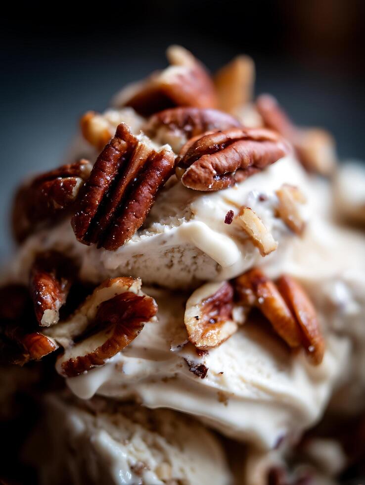 Close Up of Creamy Ice Cream Topped with Pecan Pieces. photo