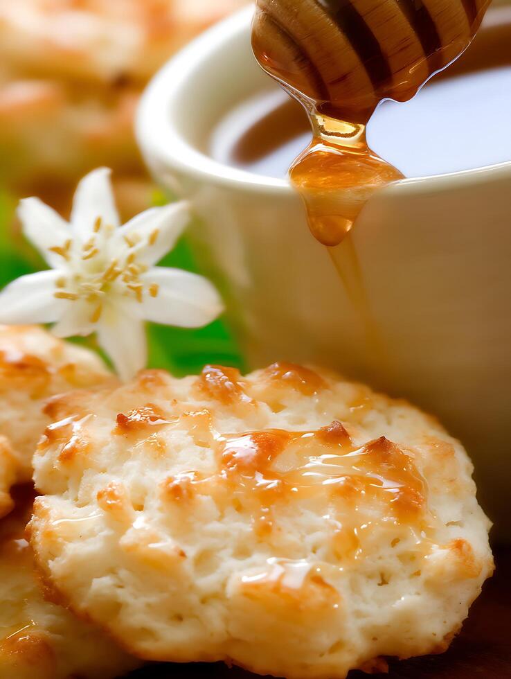 Honey Drizzled Over Sweet Biscuits and Orange Blossom. Close up of delicious dessert. photo