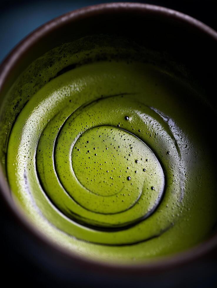 Close up of Swirling Matcha Green Tea in a Bowl. photo