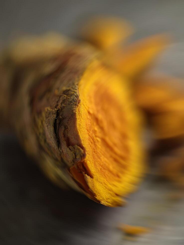 Turmeric Root A Close Up of Vibrant Yellow and Brown Hues. photo