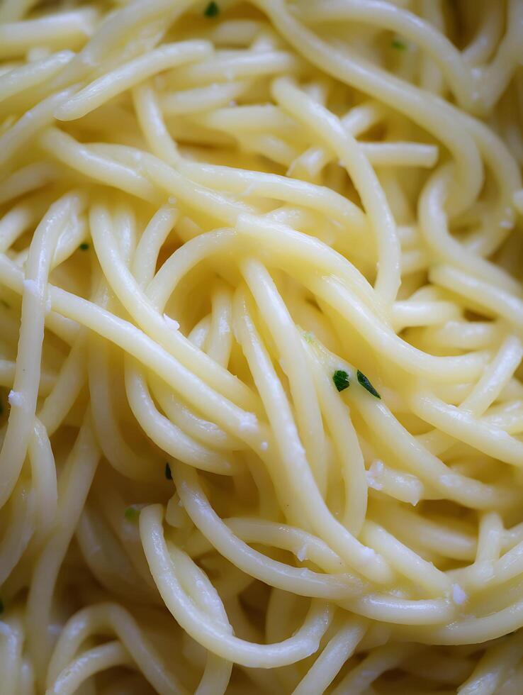 Close Up of Cooked Spaghetti with Parmesan Cheese and Herbs. photo
