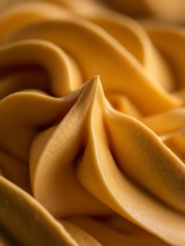 Close Up of Swirled Caramel Cream Texture, Delicious Sweet Treat. photo