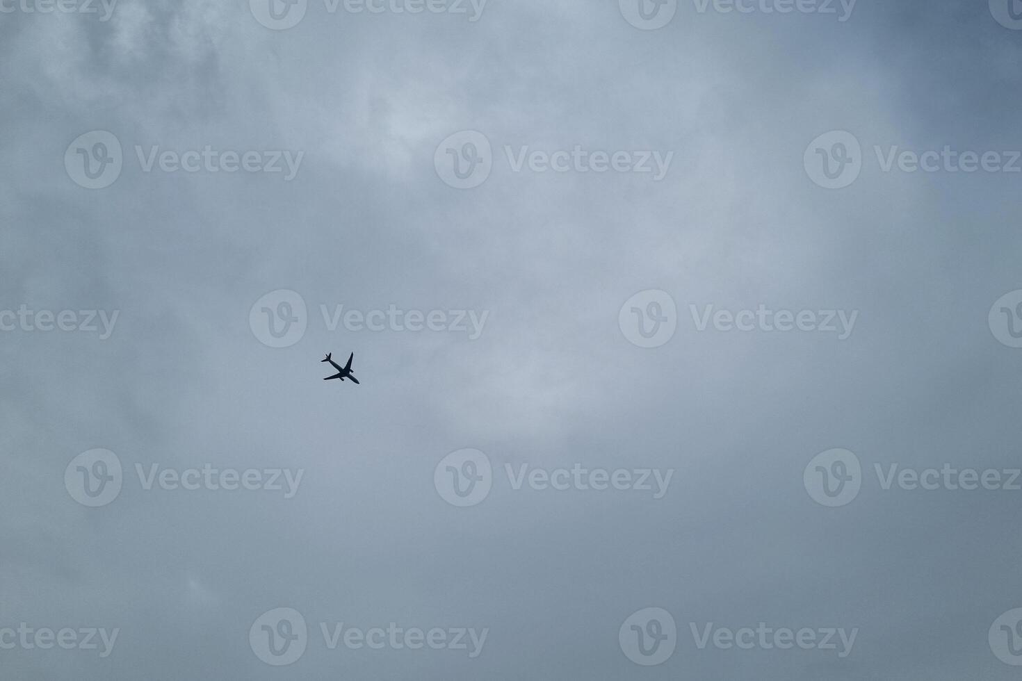 Airplane Silhouette Against Cloudy Sky - Tranquility and Wanderlust for Travel Themes photo