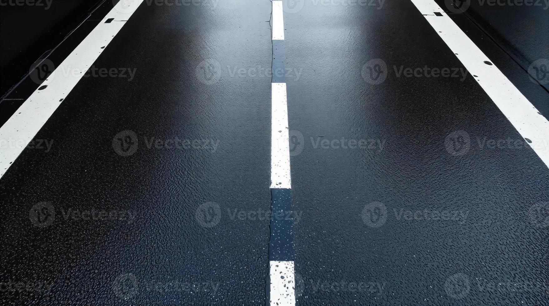 A black road with white lines on it photo