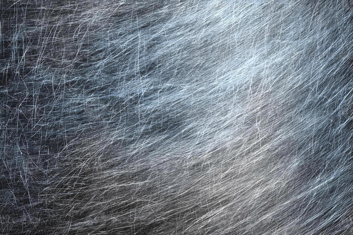 Cool-toned scratched metal surface with swirling fine lines. photo