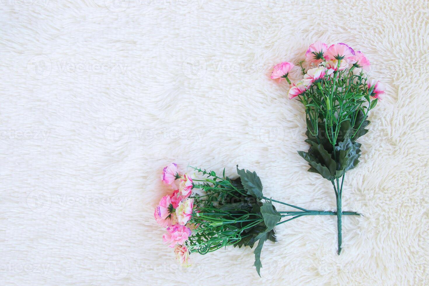 bouquet of flower on white artificial wool background photo