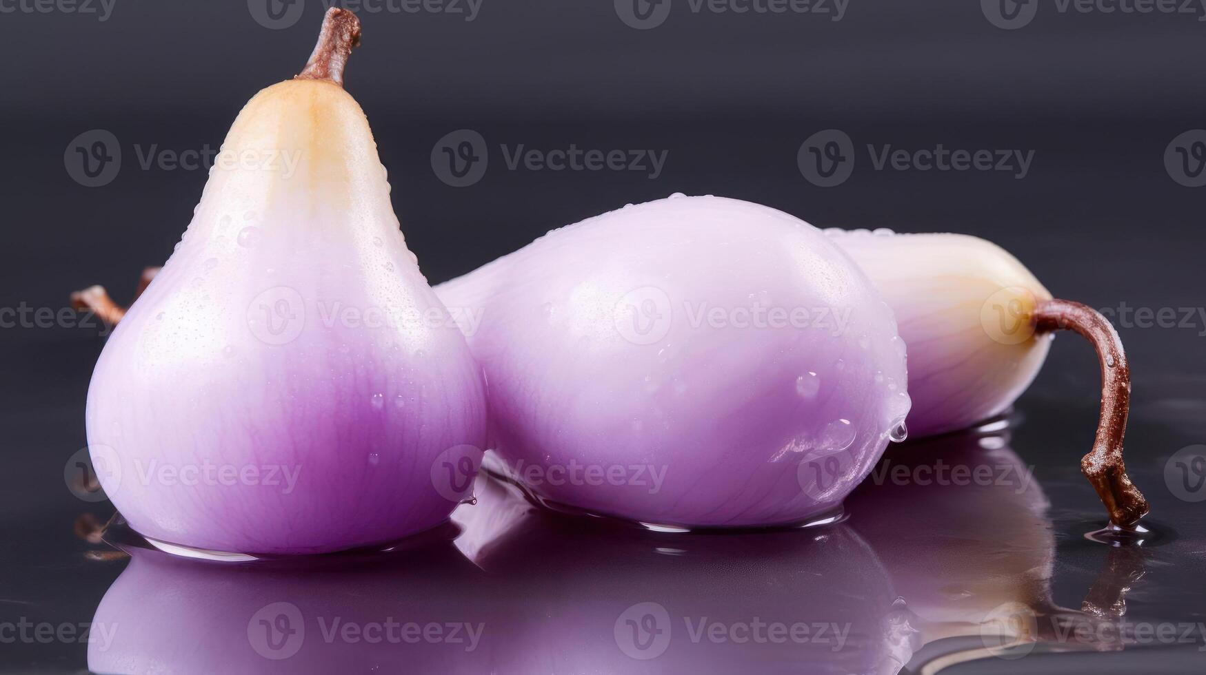 Three purple onions with water droplets, close-up view. photo