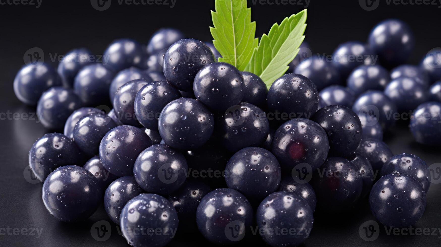 Fresh blackcurrant berries with leaves, close-up, dark background. photo
