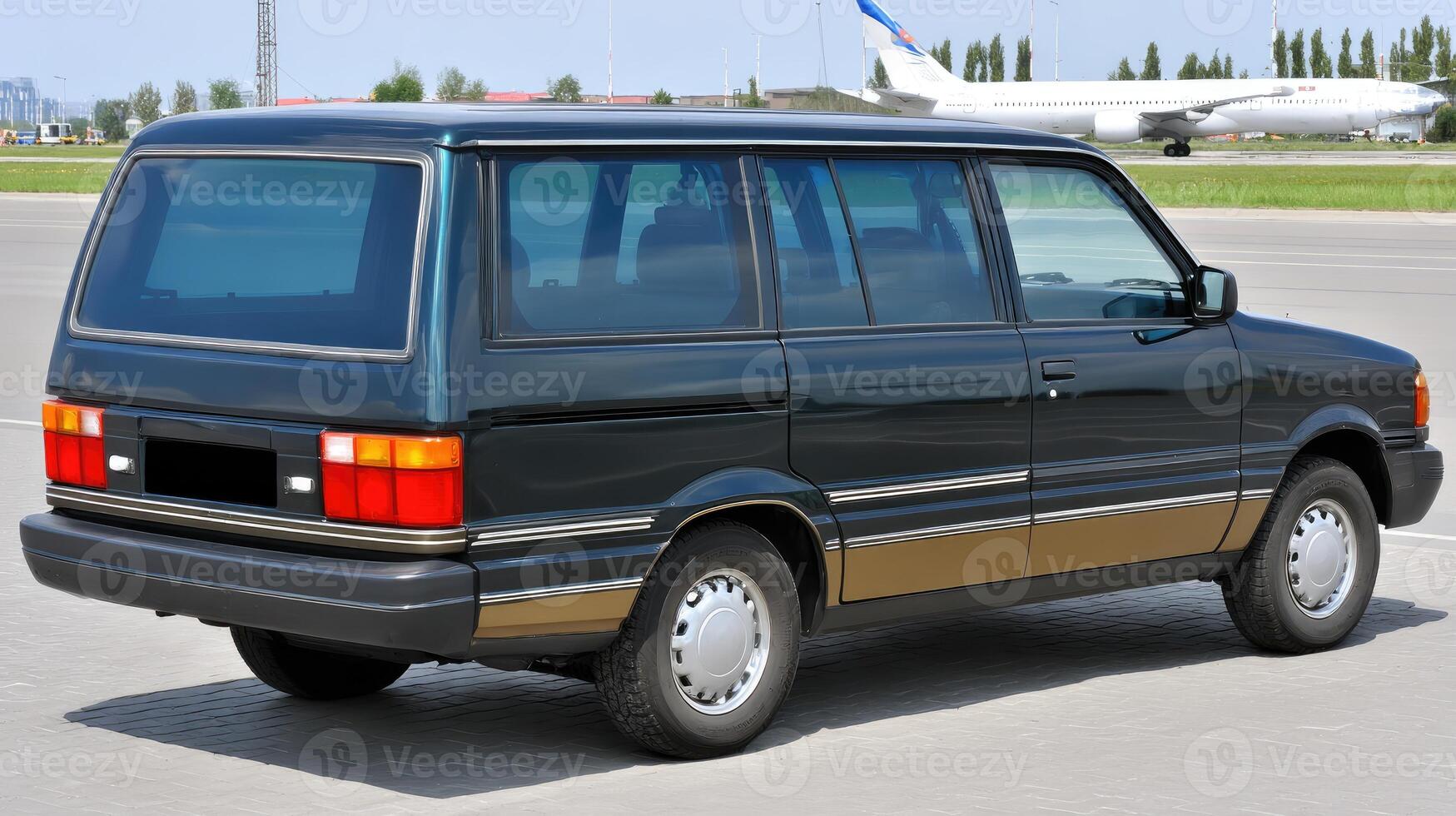 A small van parked on the tarmac with an airplane in the background photo