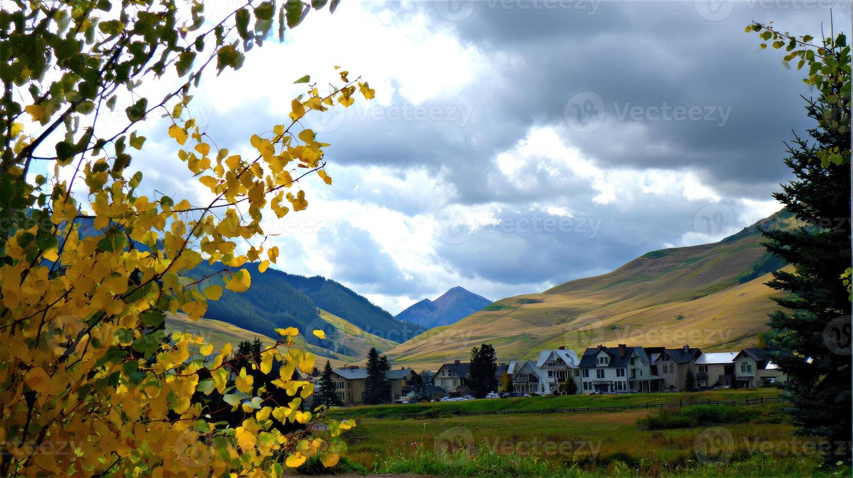 A view of a mountain range with a town in the background photo