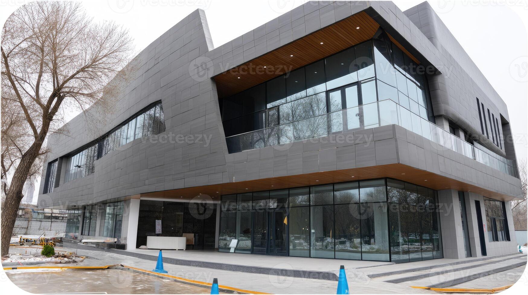 Modern architectural design features angular shapes and extensive glass in a prominent building situated in a snowy environment photo