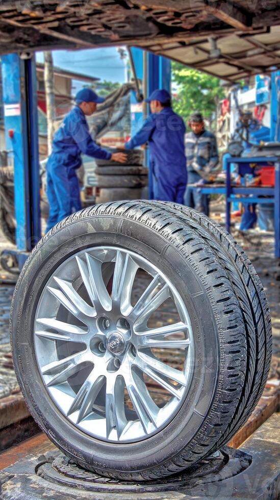 A tire on a car in a garage photo