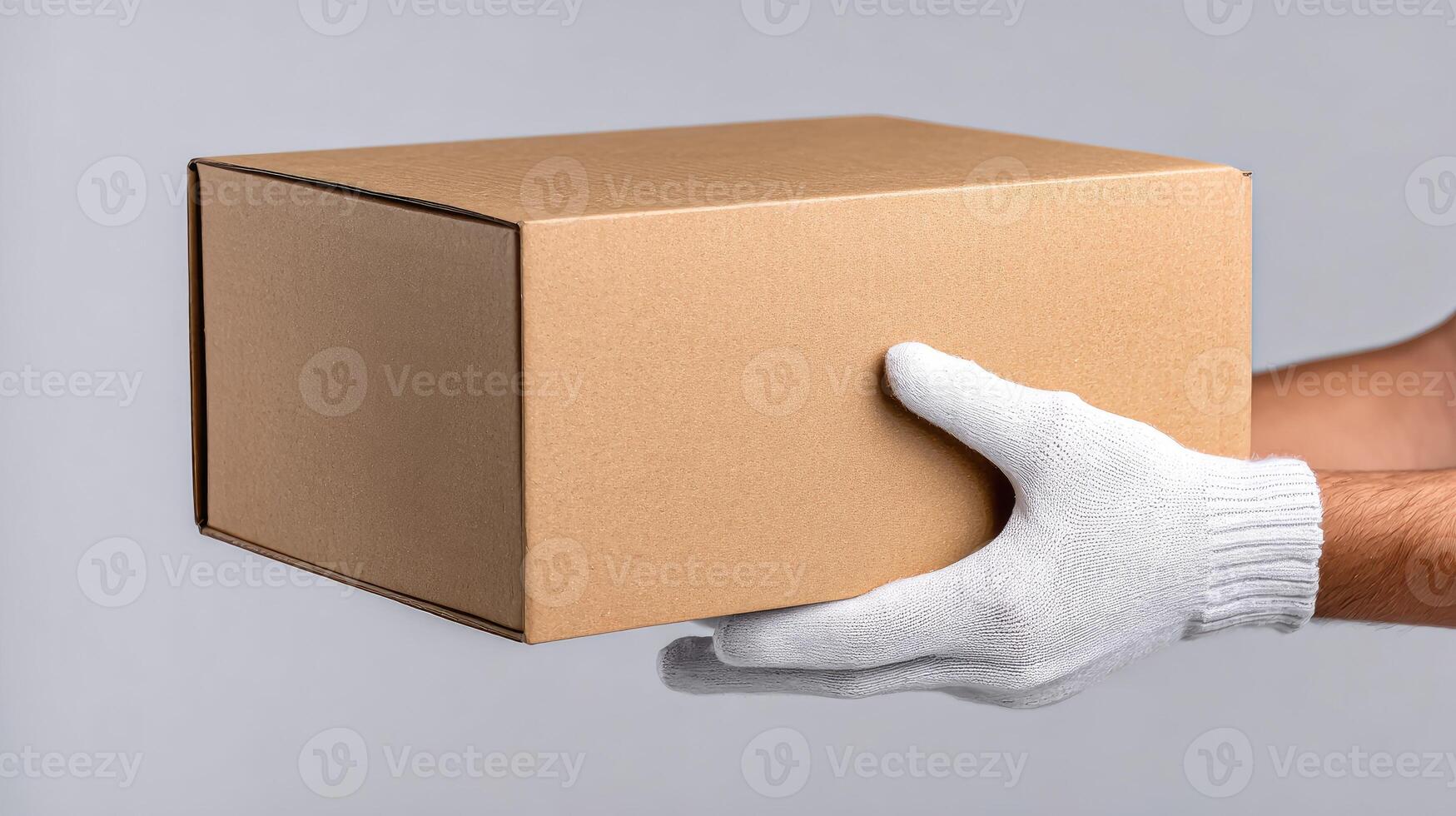 A man in white gloves holding a cardboard box photo