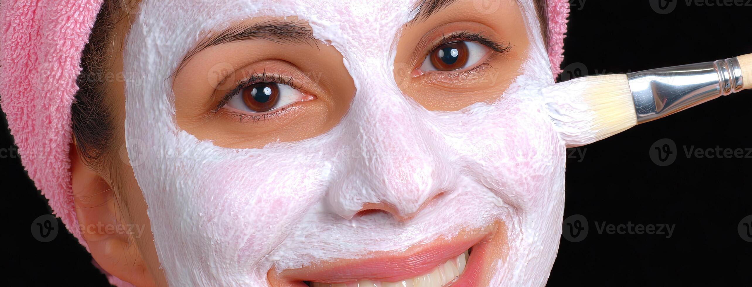 A woman with a white face mask on her face photo