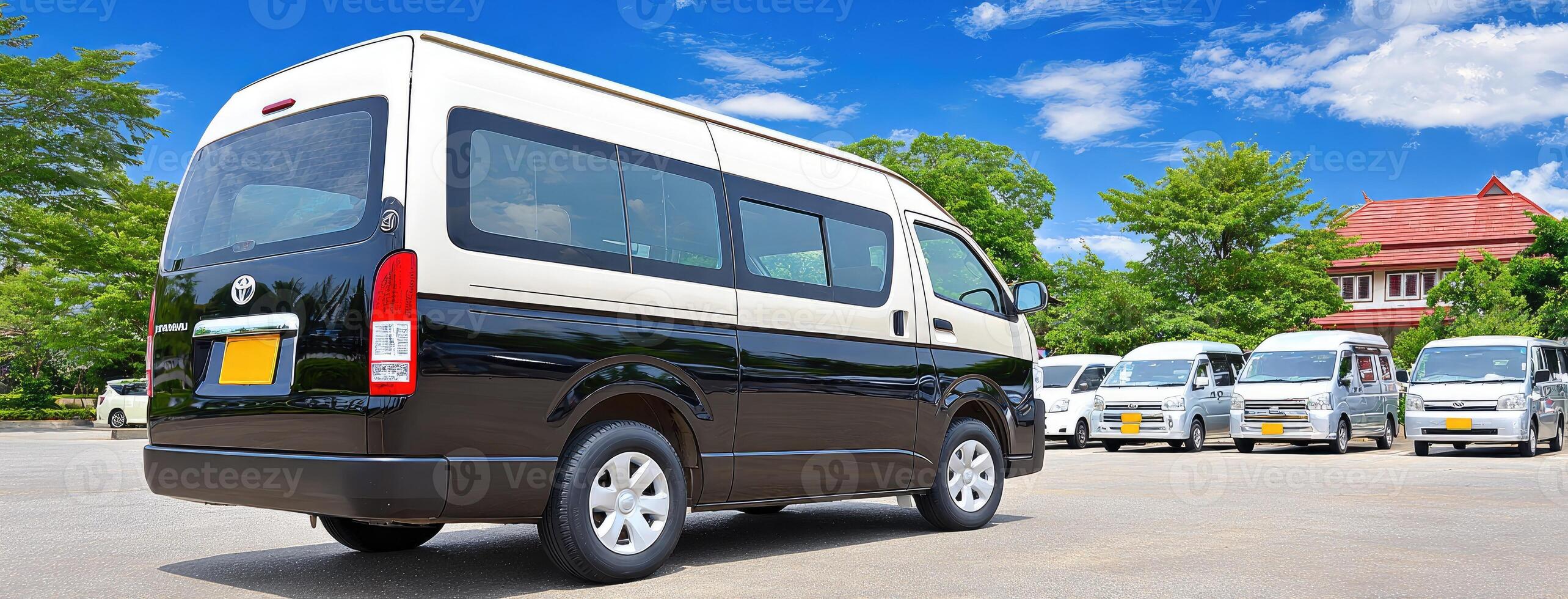 A van parked in a parking lot with other vans photo