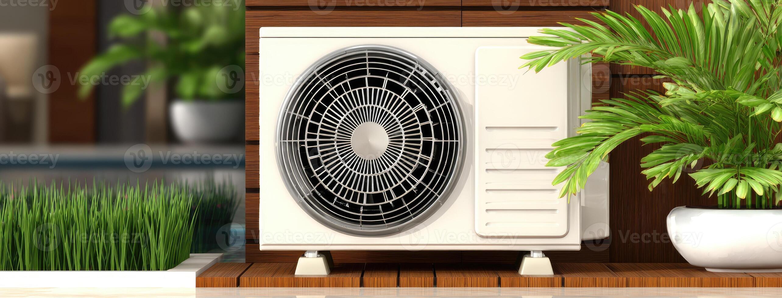A small air conditioner is sitting on a wooden deck photo