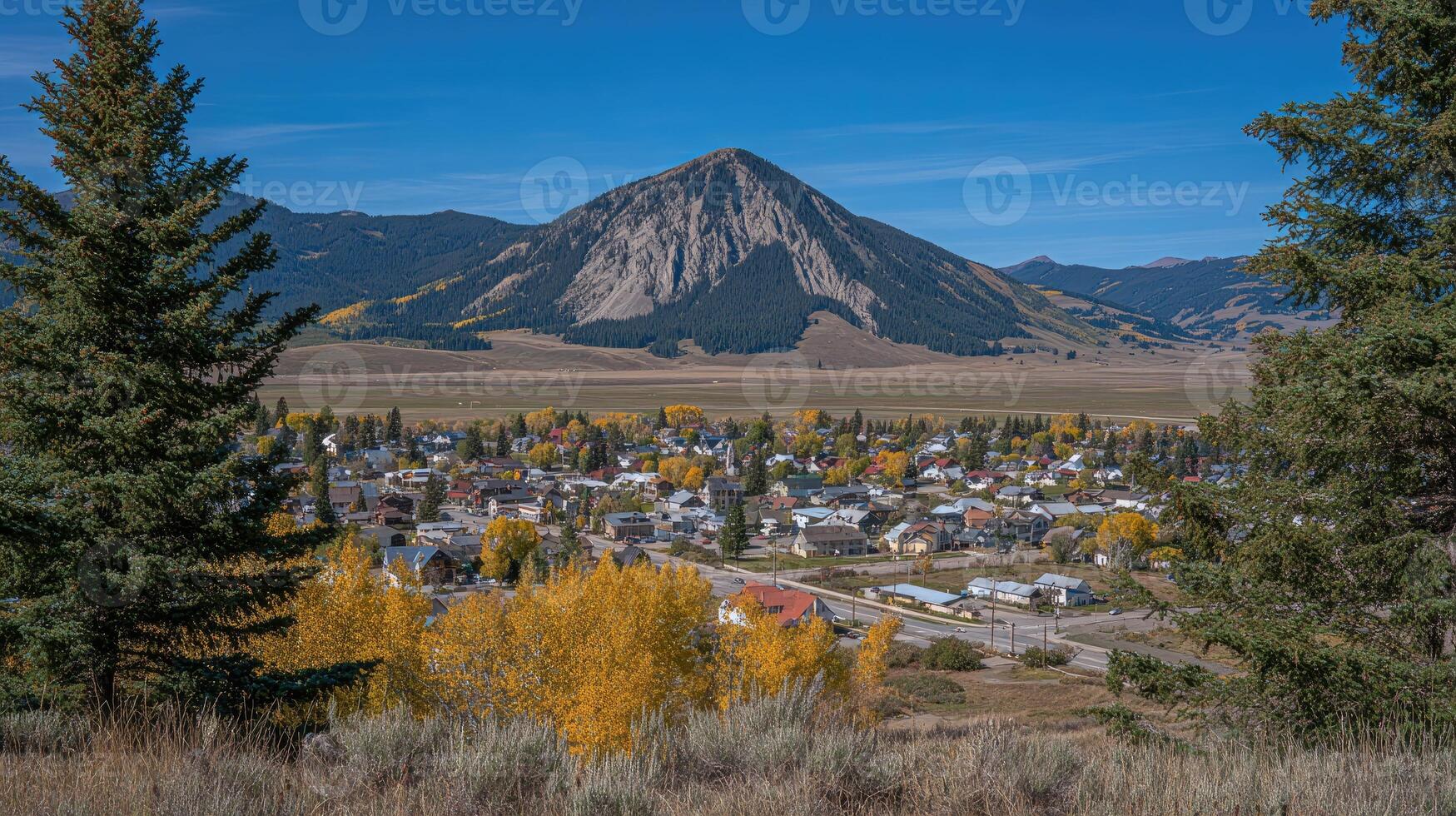 A view of a town with a mountain in the background photo