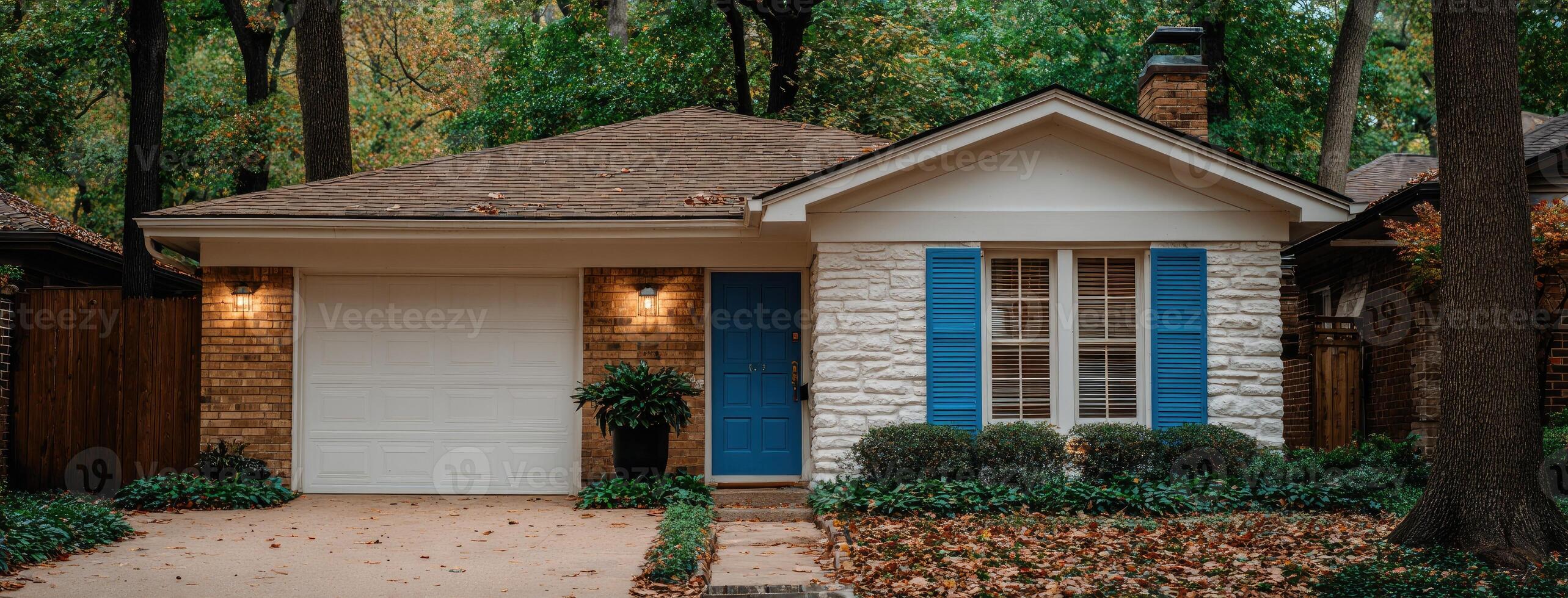 A small house with blue shutters and a white door photo
