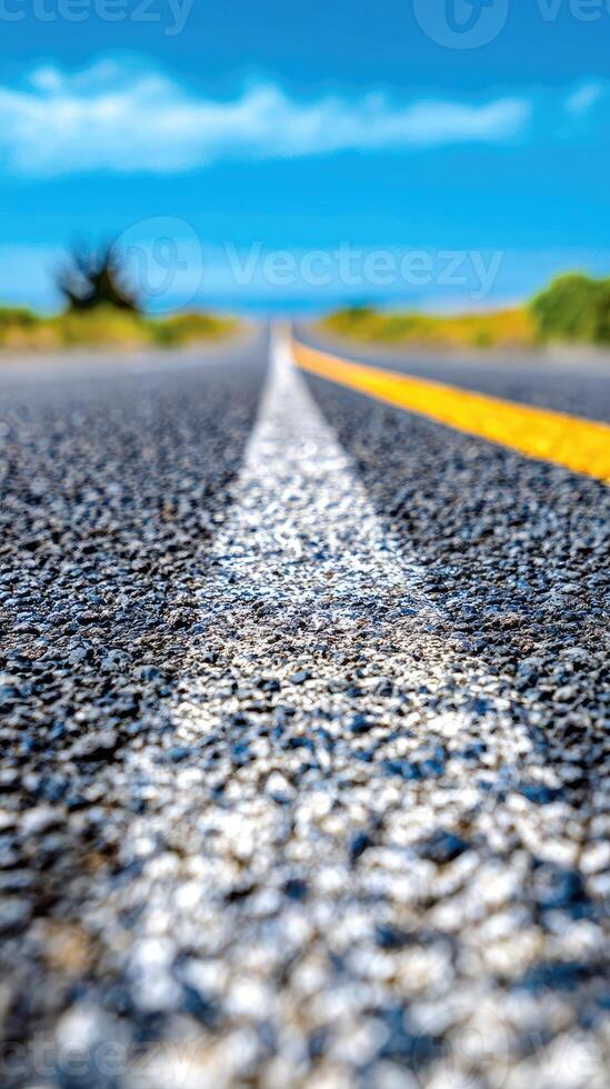 A road with a yellow line on the side photo
