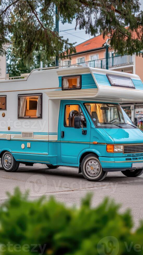 A blue and white camper van photo