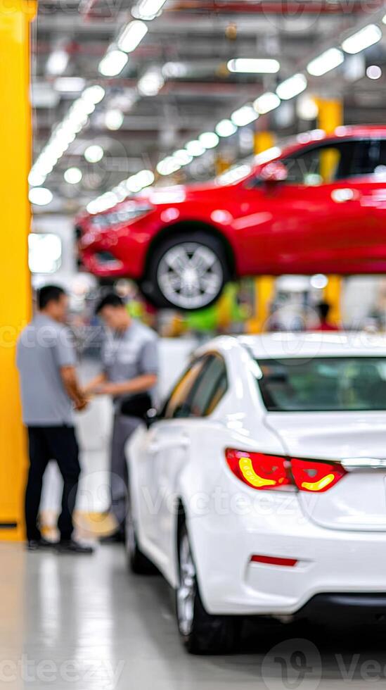 A car is being inspected in a factory photo