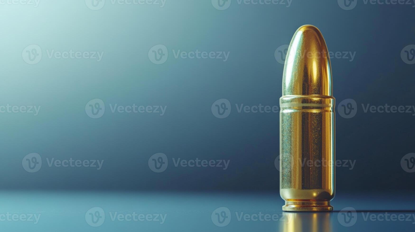 Golden bullet standing on dark blue background representing danger and violence photo