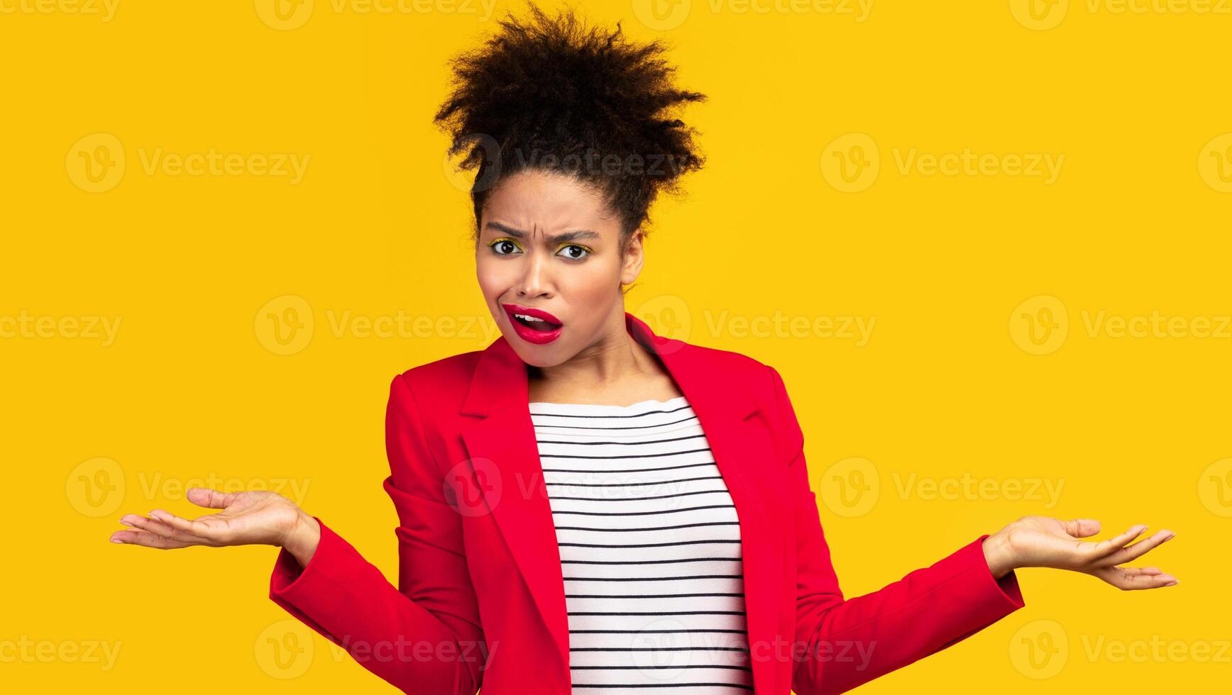 I Don't Know. Annoyed afro girl shrugging shoulders with spreaded hands, woman doesn't understand you, copyspace photo
