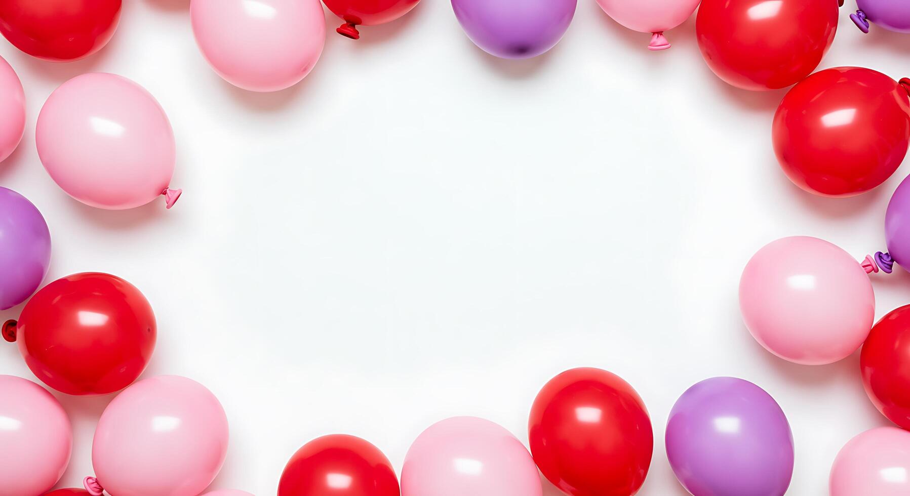 Many pink, purple and red balloons are arranged in a circle photo