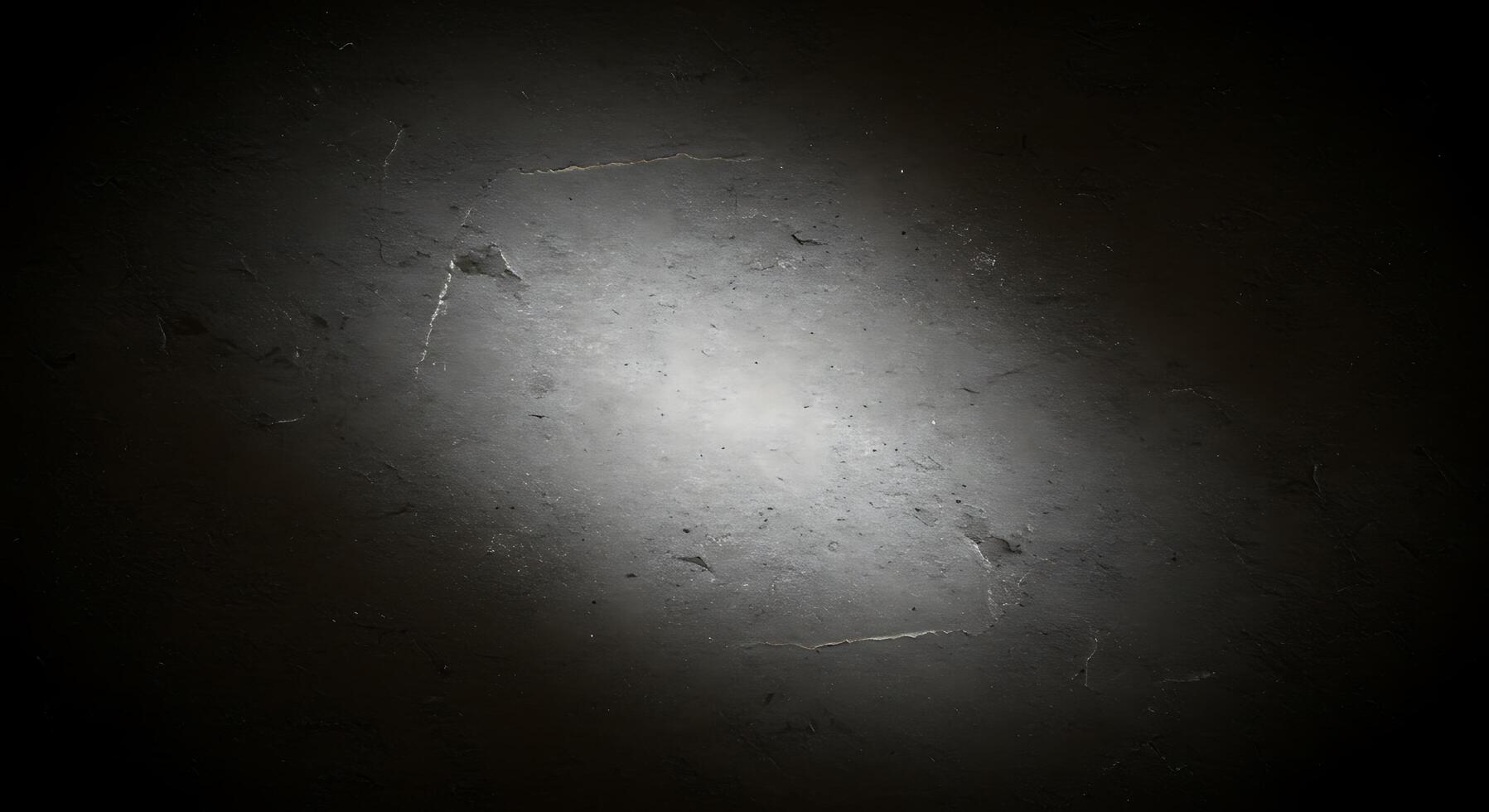 A dark and dirty wall with a light shining through it photo