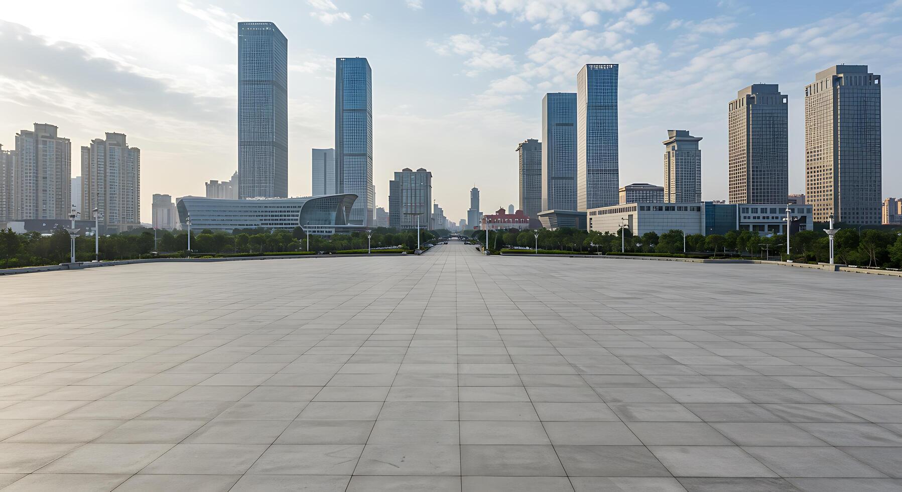 A large empty paved area with tall buildings in the background photo
