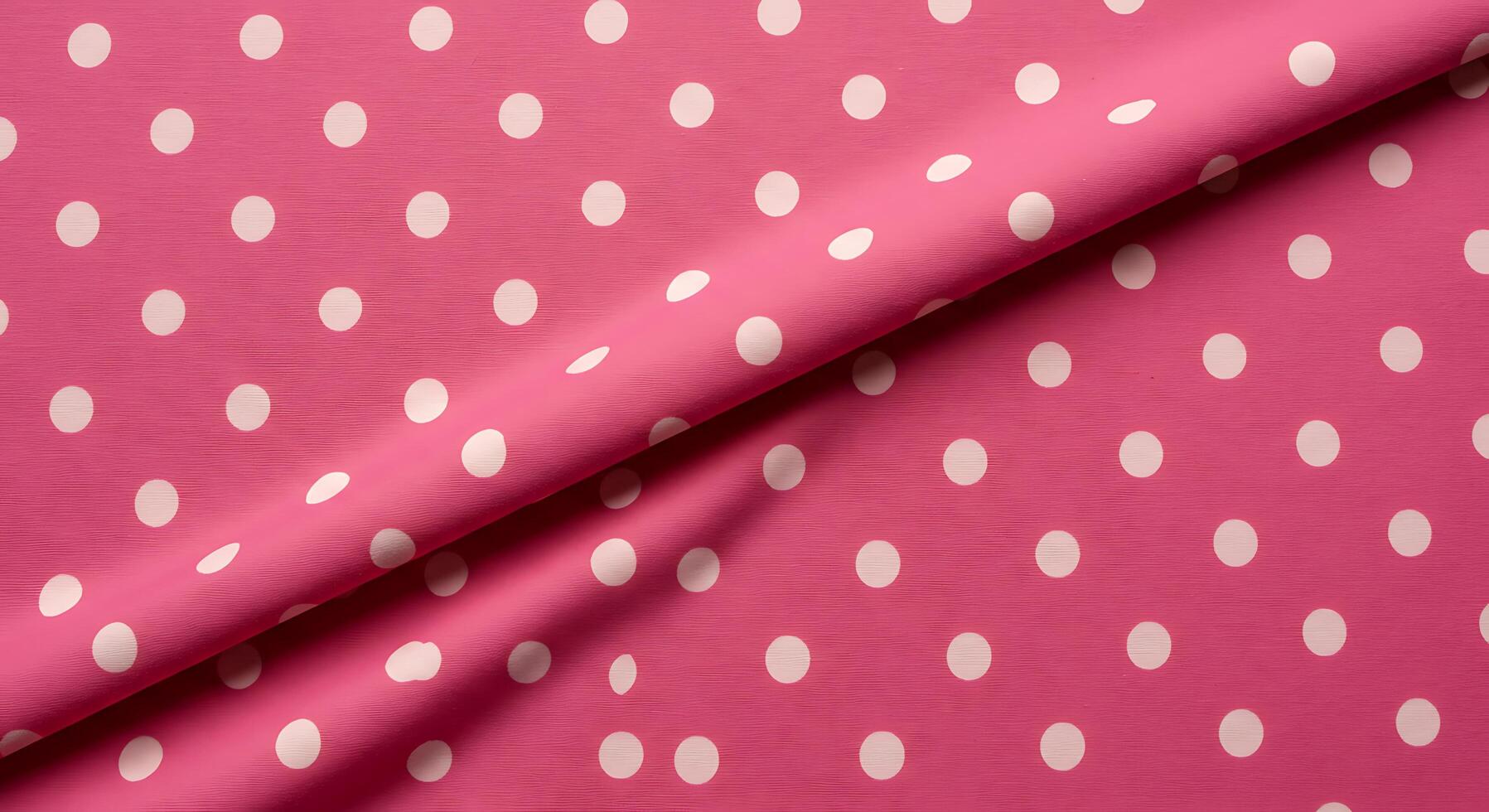 A pink polka dot fabric with white polka dots photo